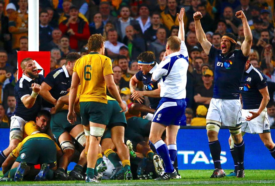  Scotland celebrate after winning a penalty to secure victory over Australia