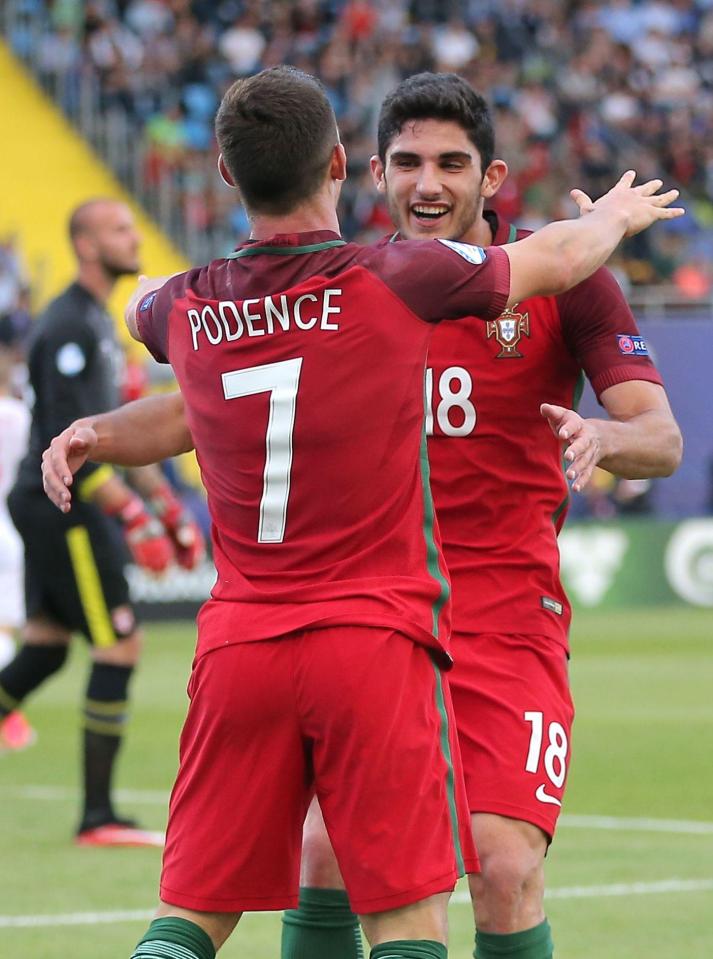  The goalscorer wheels away to celebrate heading his side into the lead with his team-mates