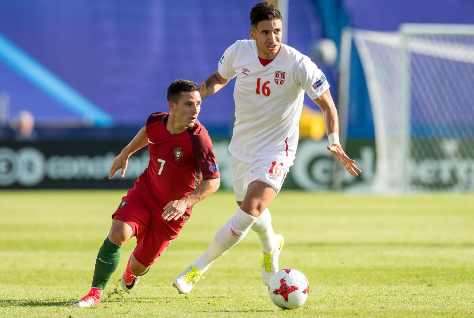  Marko Grujic attempts to launch an attack for Serbia, who may feel the 2-0 scoreline was somewhat harsh