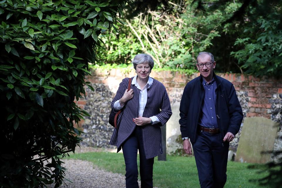  Theresa May with husband Philip arriving at church on Sunday. The PM's response in the aftermath of the blaze has been criticised