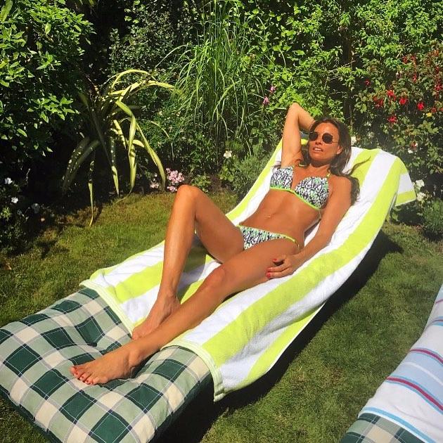  Mel, 46, is a fan of topping up her tan in the garden