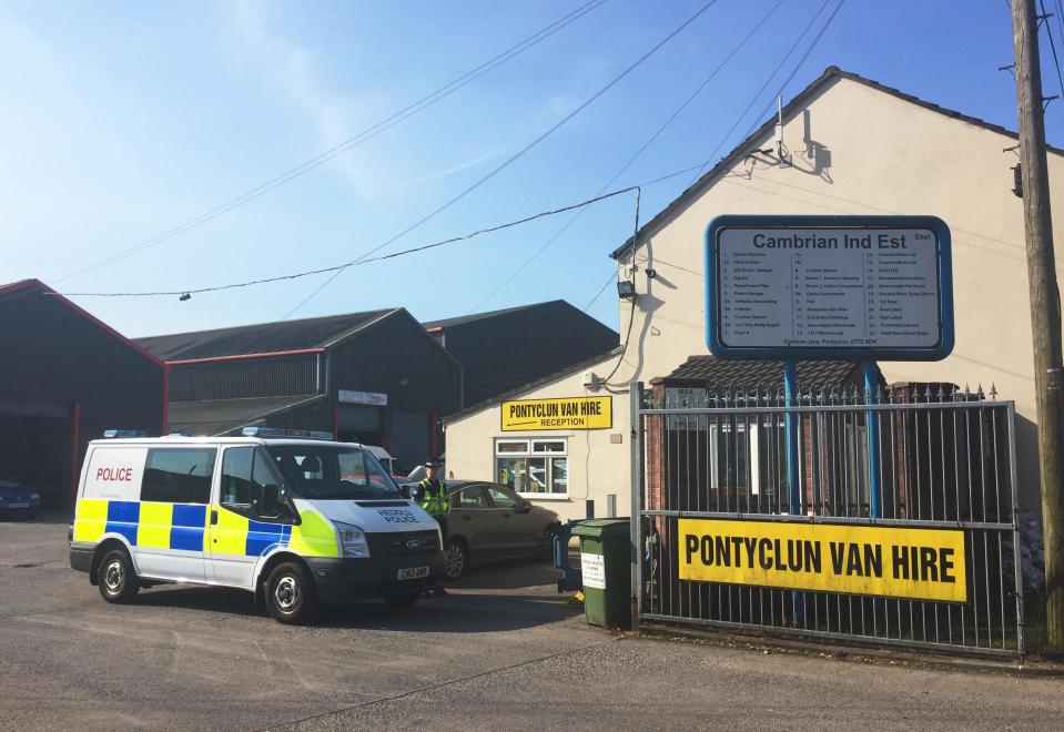  A police van outside Pontyclun Van Hire in Wales where the vehicle is believed to have been hired from