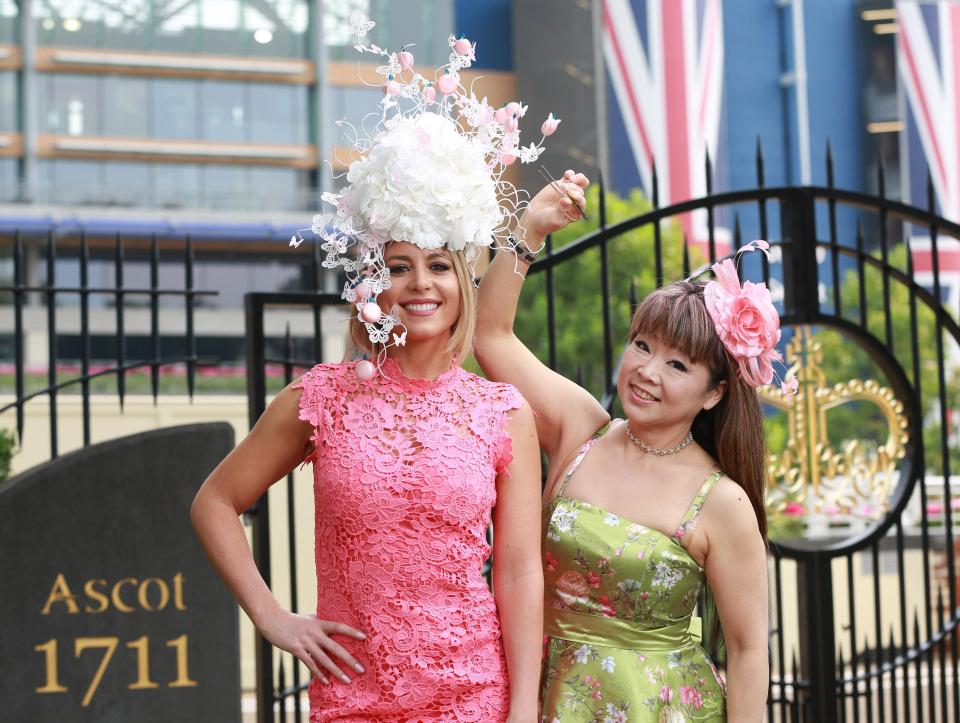  Coral bookmaker’s ambassador Carly Baker, left, modelled the edible hat designed by Cherish Finden, right