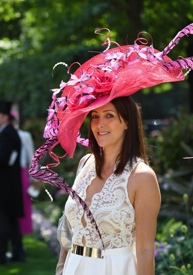  Punter Sara Davidson arrived at the races in a white lace dress that had a daringly low-cut neckline and a huge pink hat that was adorned with butterflies