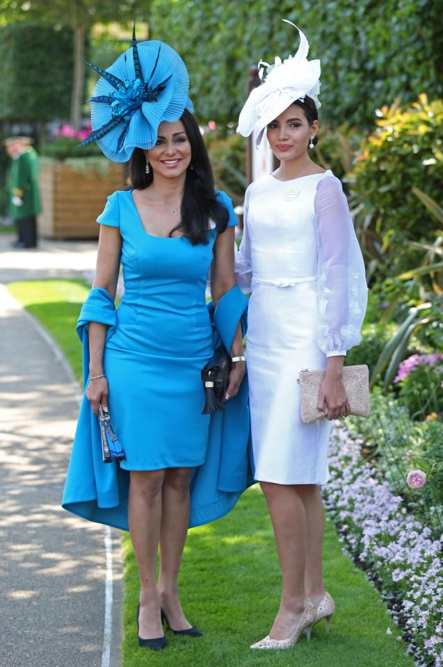  One woman wowed in a head-to-toe bright blue outfit, while her pal opted for an all-white look on the first day of Royal Ascot