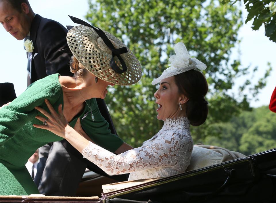  The Duchess of Cambridge leaps to the rescue as Sophie Wessex is photographed nearly falling out of their horse drawn carriage as the royals arrive at Royal Ascot