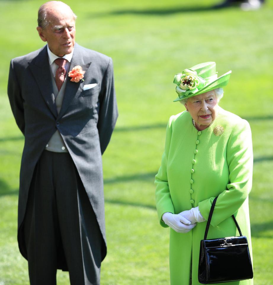  The Queen and Prince Philip were applauded by merry racegoers at they arrived at the prestigious horse racing event