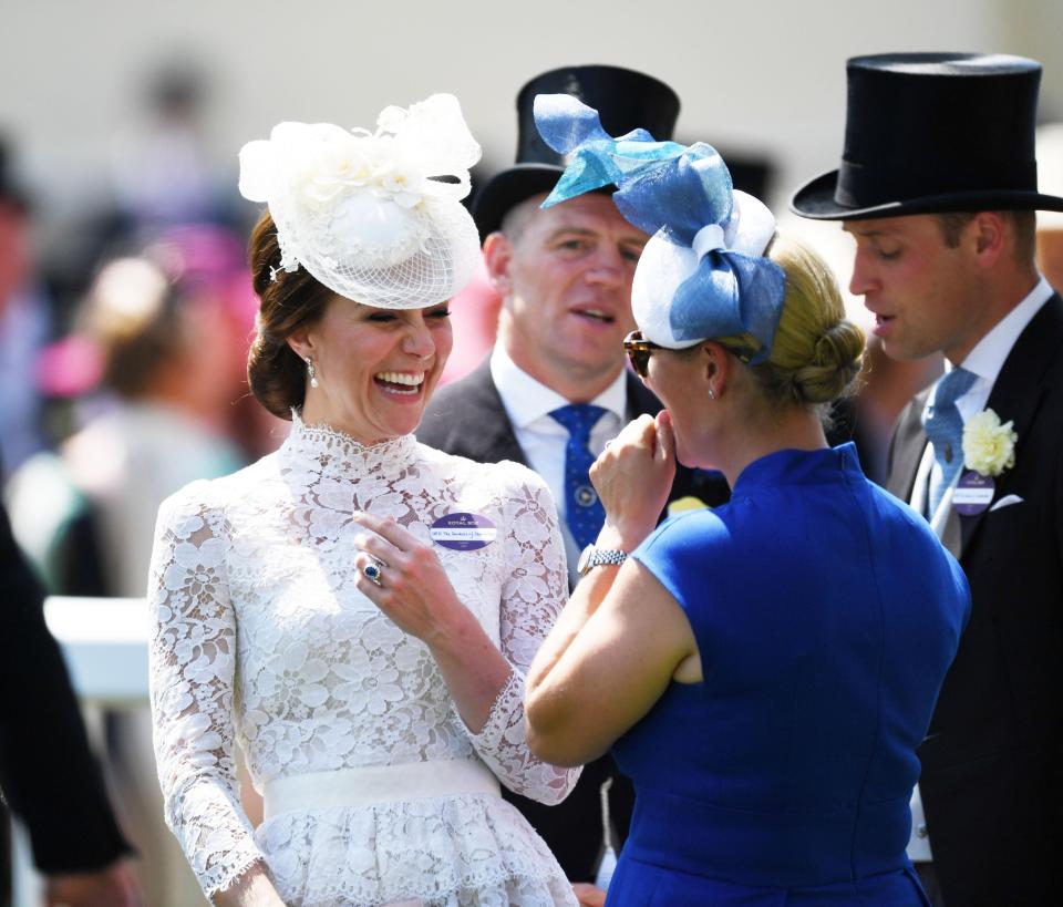  Kate was later seen laughing along with Zara Phillips, who was dressed in an electric blue dress and complimentary hat