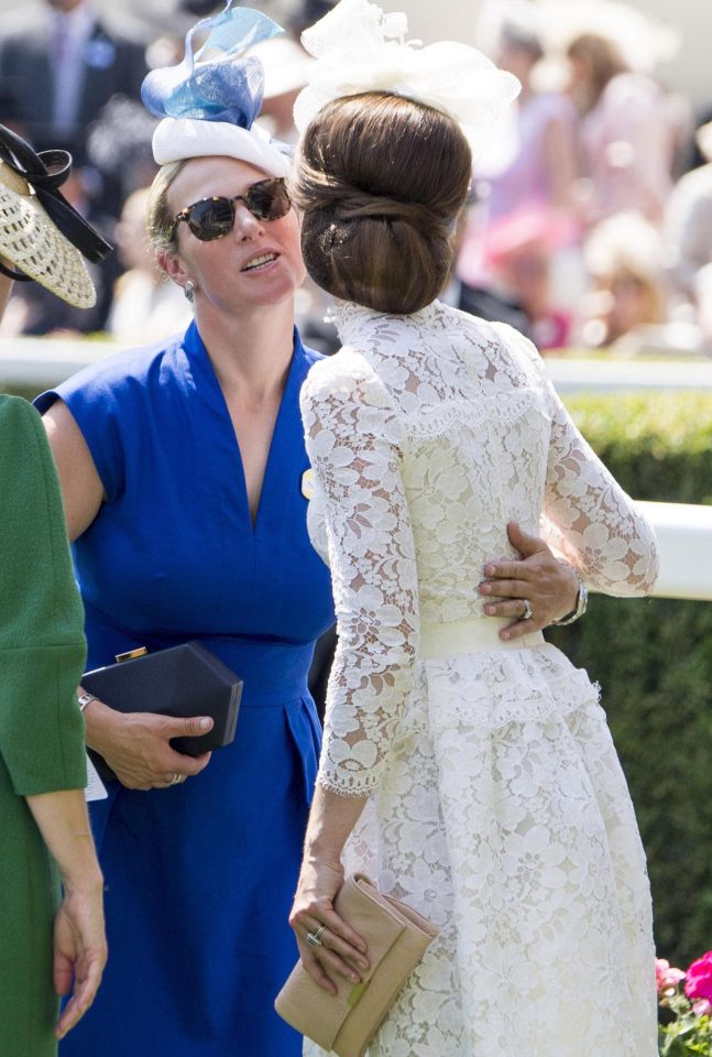  Zara Tindall greets the Duchess of Cambridge with a kiss on the cheek as they arrive at Royal Ascot