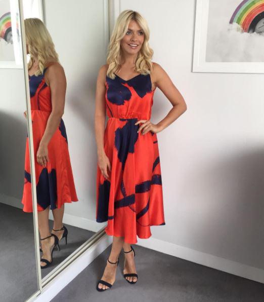  Holly Willoughby has revealed her toned arms in a summery dress on This Morning