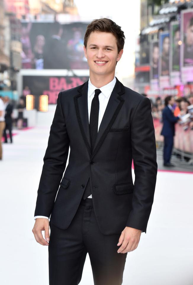  Ansel looked dapper in a classic black suit and white shirt