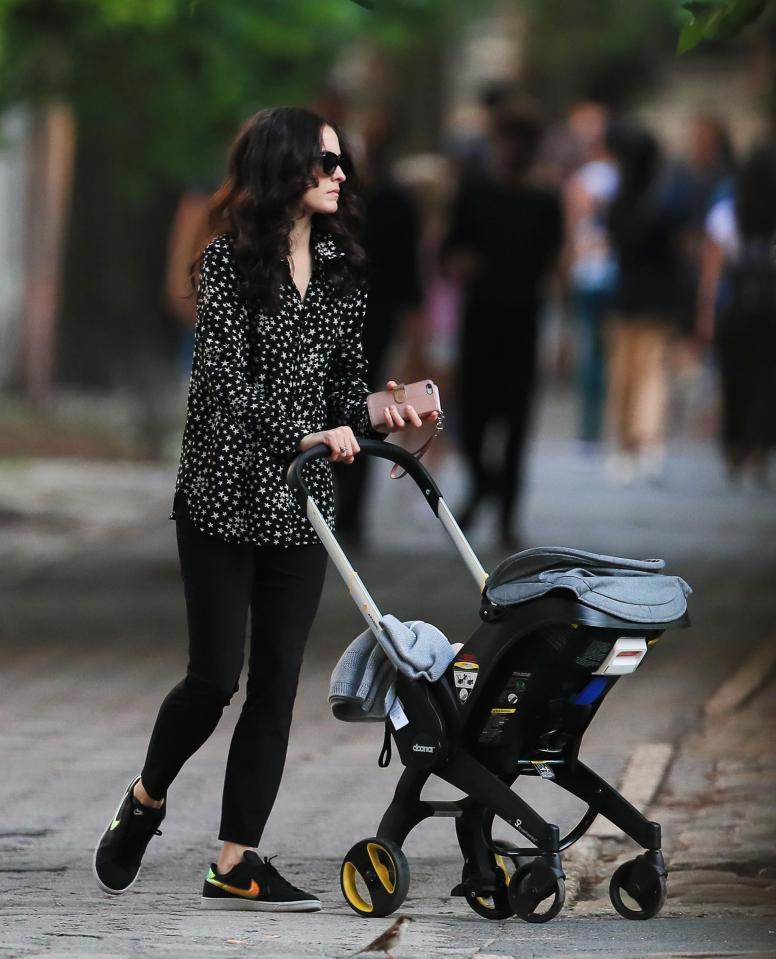  Mum and child go for a stroll after Mick's visit