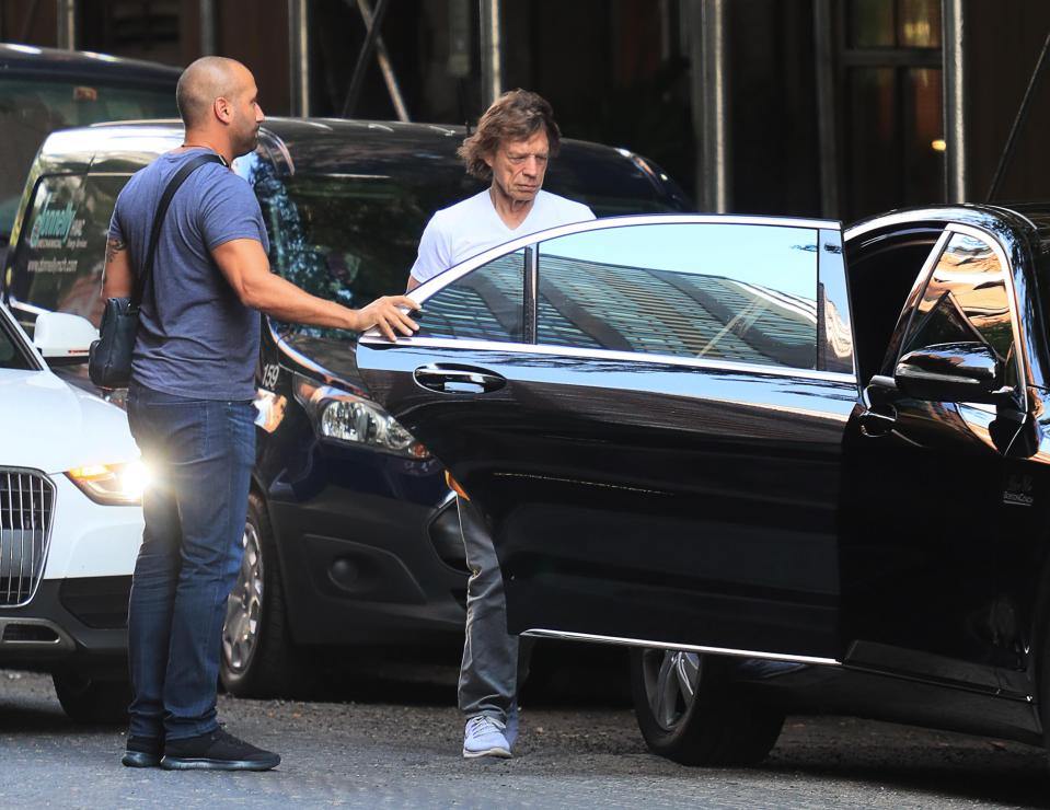  Mick left in chauffeur-driven car