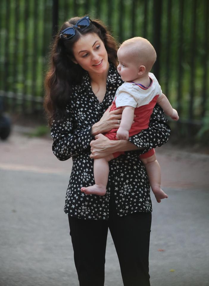  Ballerina Melanie was seen cuddling the tot, Deveraux Octavian Basil, on a  stroll