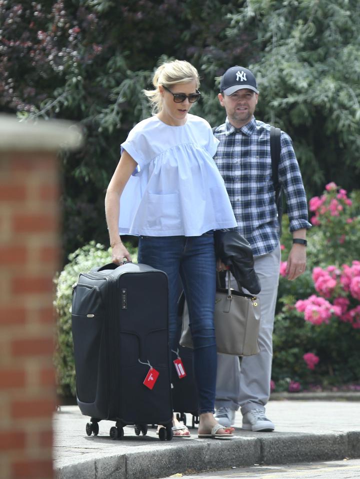  The couple were spotted loading their suitcases into a people-carrier