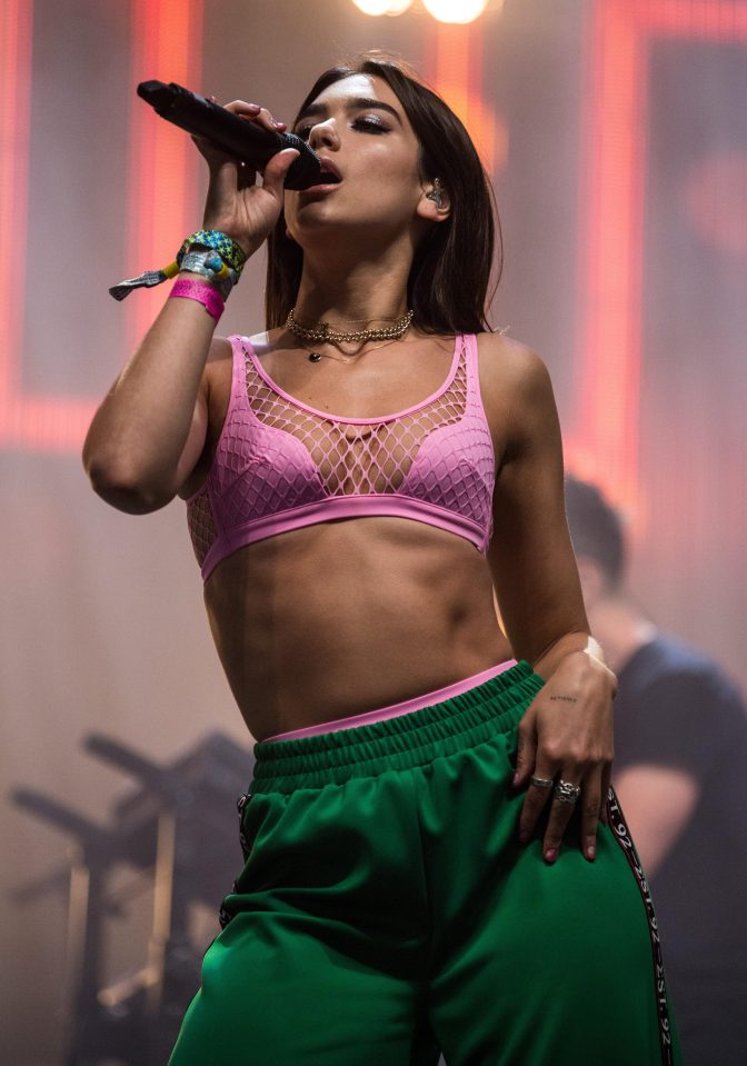  Dua Lipa wows fans with figure-hugging trousers at Glastonbury