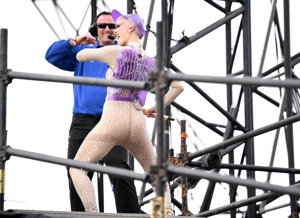  Katy enjoyed a dance with a member of security during her act