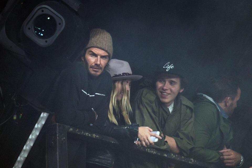  David Beckham back stage at Glastonbury with son Brooklyn