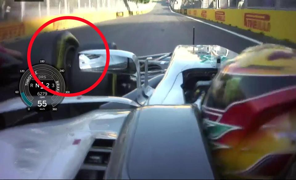  The view from Lewis Hamilton's car as the Ferrari of Seb Vettel collides with the front left wheel