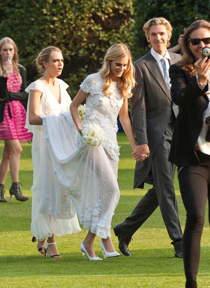 Cara Delevingne wore white as a bridesmaid when her sister Poppy got married