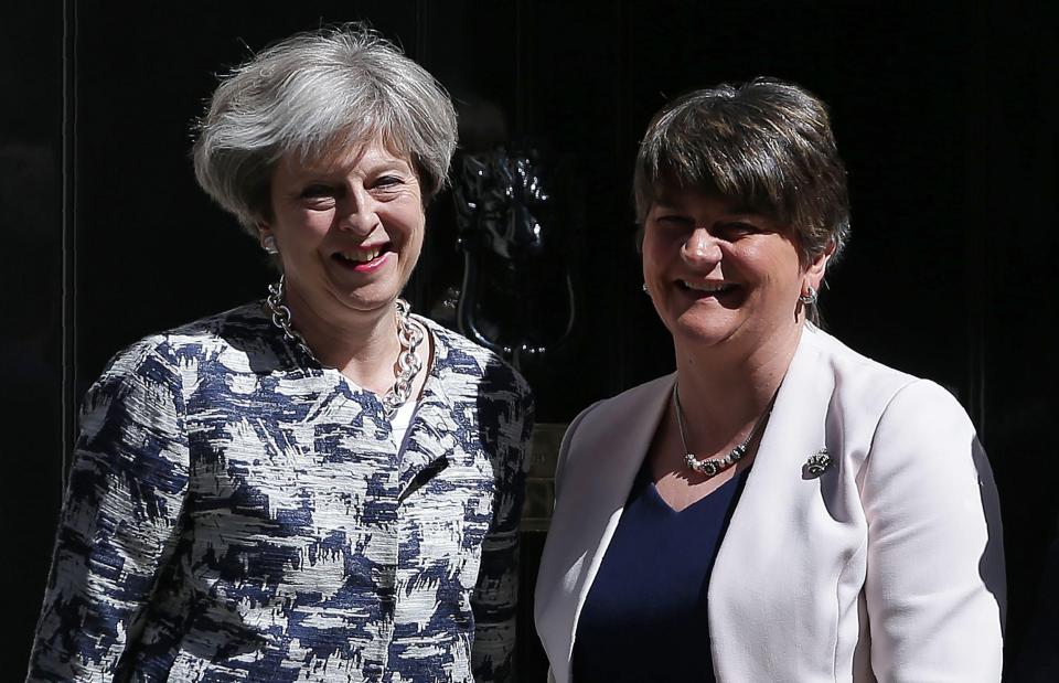  Theresa May and Arlene Foster outside no10 after signing a deal that could cost British taxpayers £24.3bn