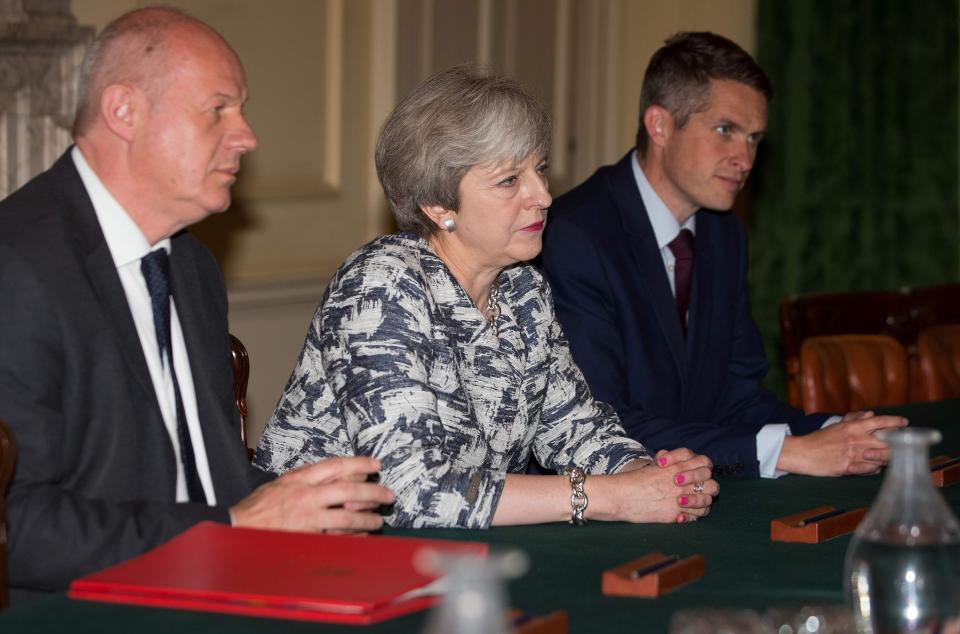  Theresa May sits with Britain's Secretary of State Damian Green (left) and Parliamentary Secretary to the Treasury, and Chief Whip, Gavin Williamson (right) during negotiations