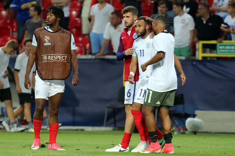  Redmond is consoled by England players and Germany winger Serge Gnabry