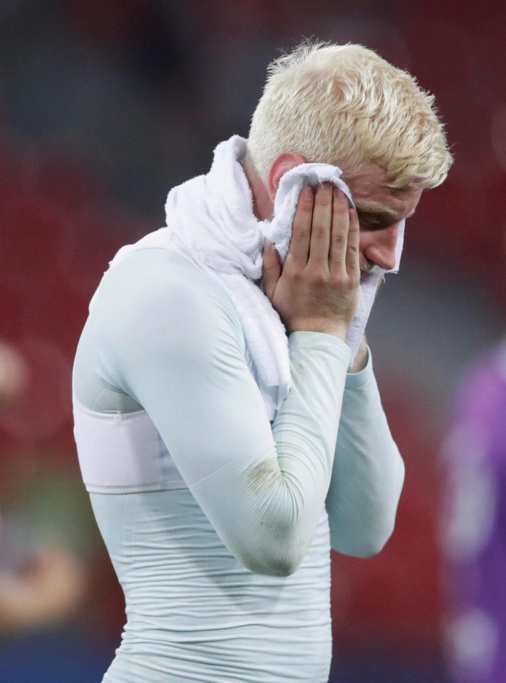  A gutted Will Hughes trudges towards the dressing room in Poland