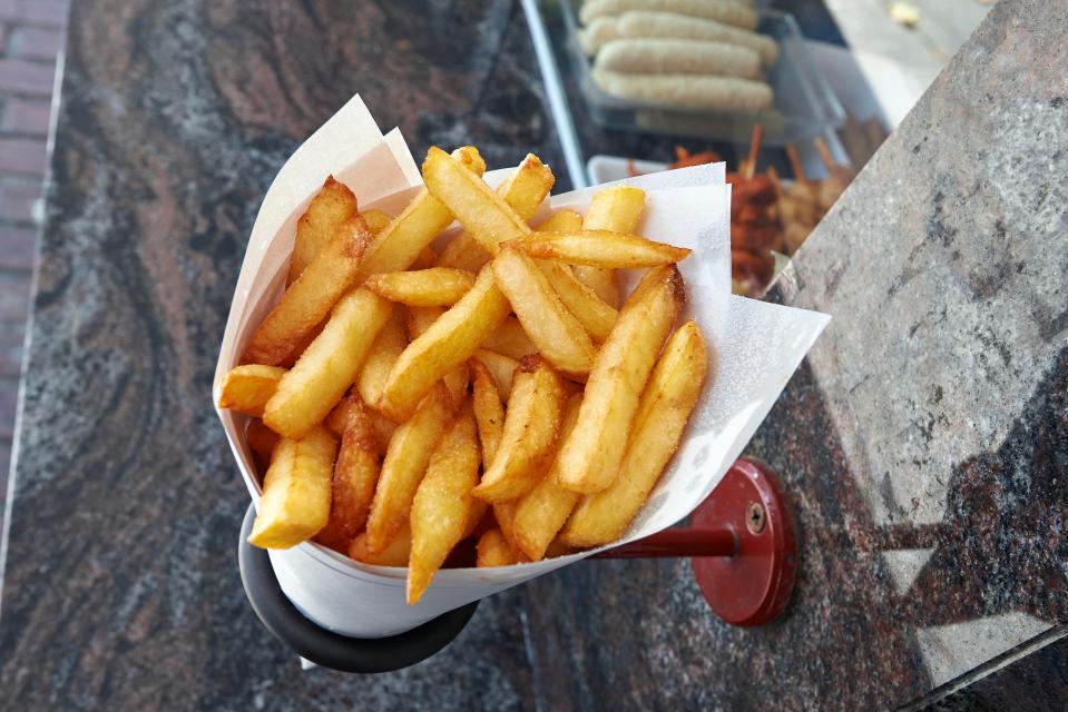  Some chip shops in Bruges are selling frites to holidaymakers at higher cost than local customers