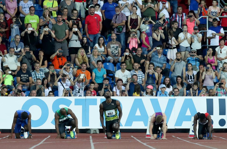 Usain Bolt gets ready to run the 100 metres in Ostrava as he gets into his blocks