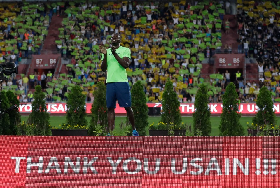 Usain Bolt laps up applause from the Ostrava crowd who also made a mosaic of the Jamaica flag in the arena