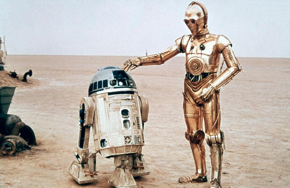  R2-D2, played by Kenny Baker, and Anthony Daniels as C-3PO on the set of the original Star Wars film in 1976