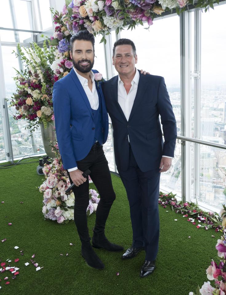  Rylan Clark-Neal stood with Tony Hadley underneath the floral arch