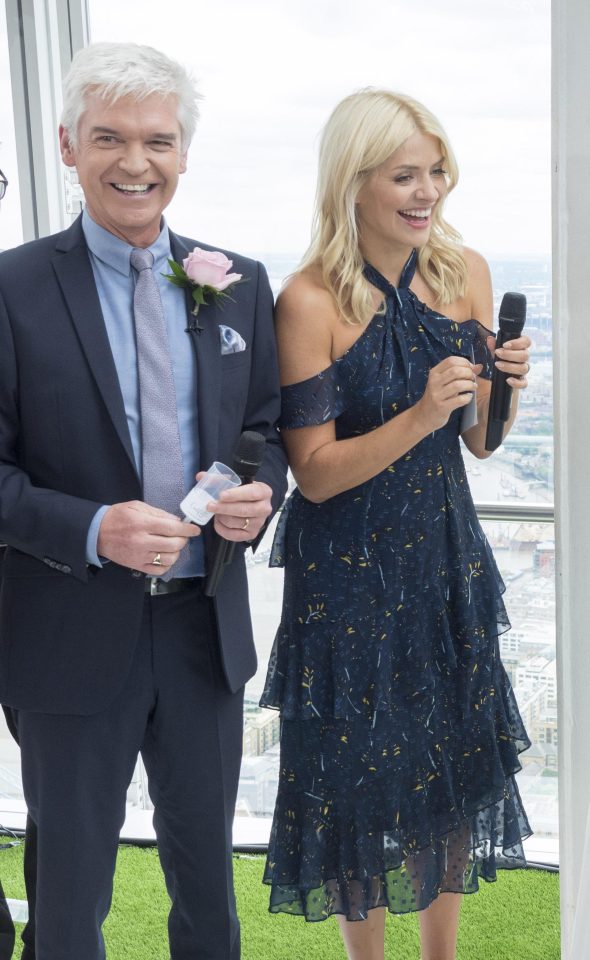  The presenter, 36, looked great in an off-the-shoulder, navy halter-neck dress and cream heels