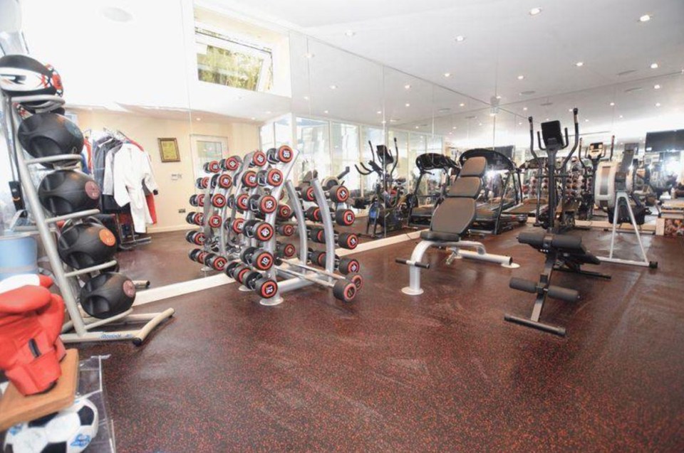 The fully-equipped gym is home to a variety of weights as well as boxing gloves and robes