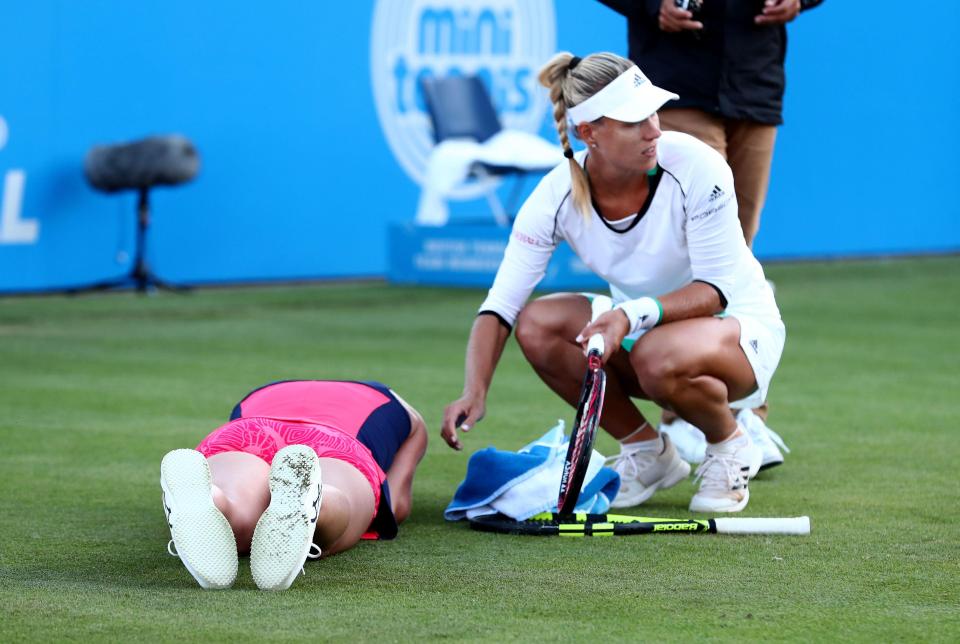  World No 1 Angelique Kerber rushes to Johanna Konta's aid after her fall