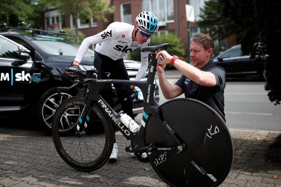  Chris Froome makes last-minute adjustments to his time trial bike ahead of the first stage of the Tour de France