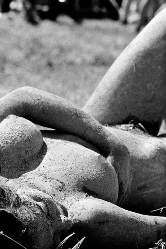  A muddy reveller can be seen bathing in the sun in this shot from 1992. Tom Jones was a surprise guest at the festival that year, which attracted 70,000 attendees