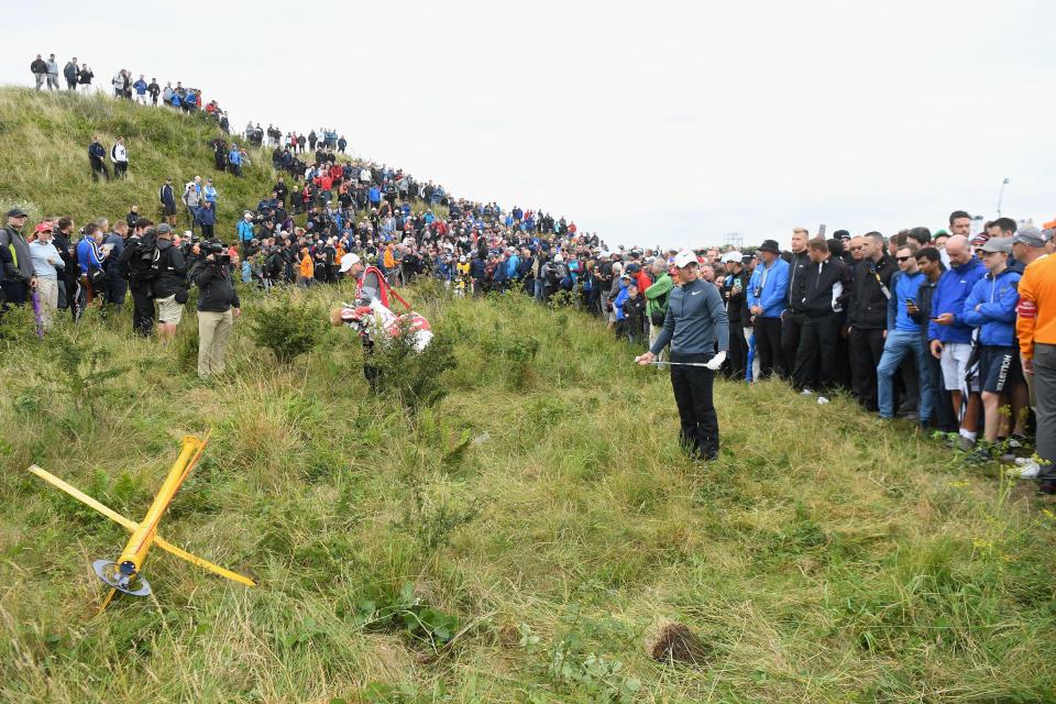  Rory McIlroy was surrounded by fans as he ordered the sign be moved