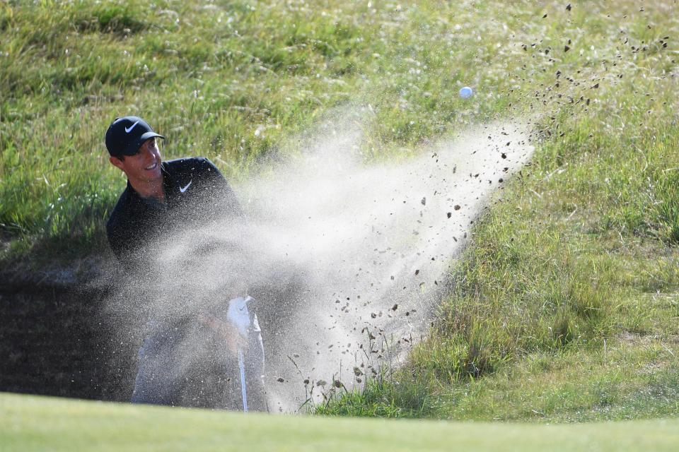  Rory McIlroy's bunker troubles on the tenth led to a double bogey