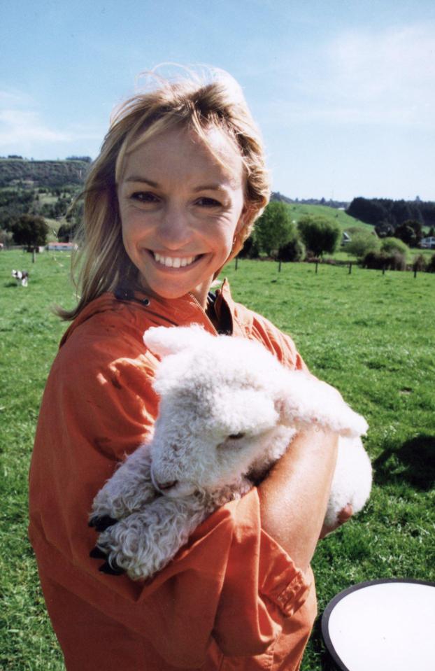  Michaela meets a lamb in New Zealand during a 1999 episode