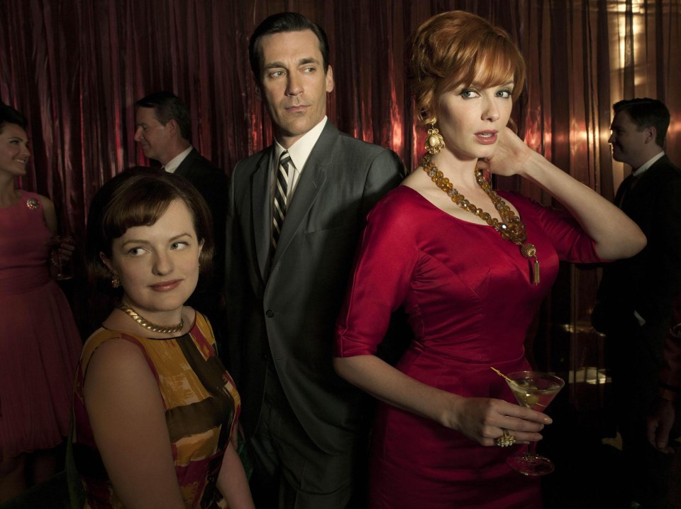 2007-15: As Peggy Olson, in Mad Men, with co-stars Jon Hamm and Christina Hendricks 