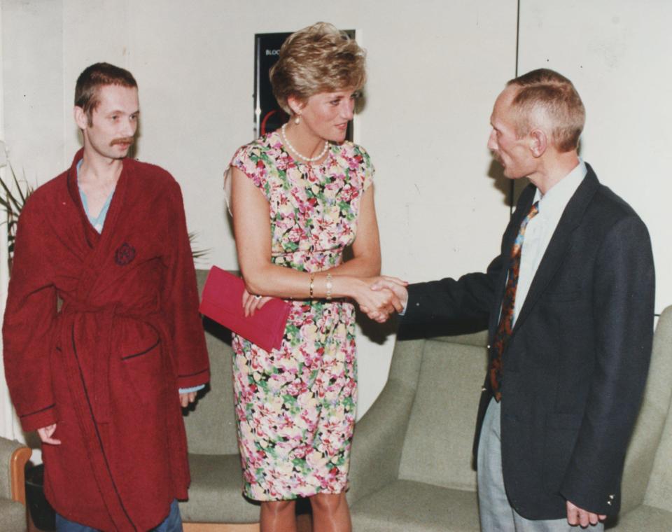  Diana shakes hands with David, another Aids patient on the ward in 1991