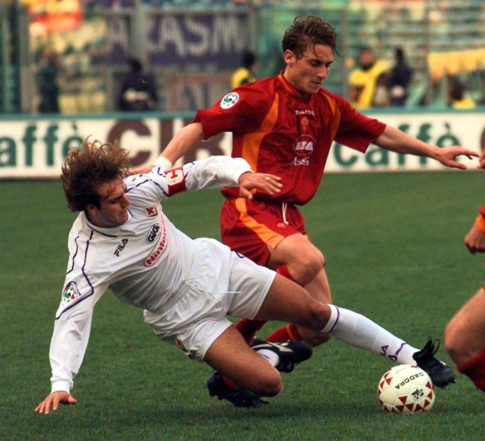  Gabriel Batistuta puts in a tackle on Francesco Totti during Roma-Fiorentina clash