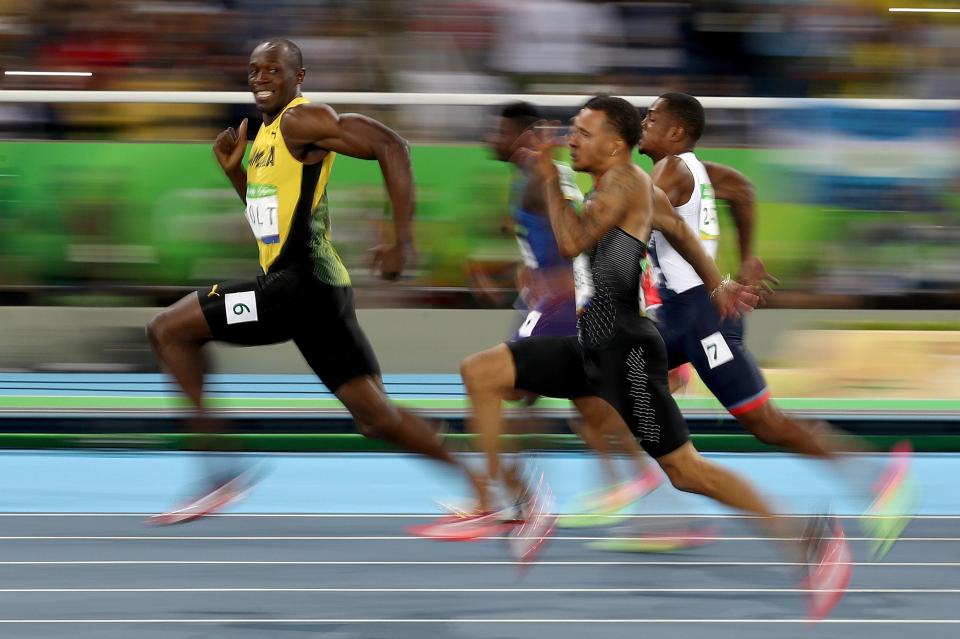  Usain Bolt grins at his rivals in the Men's 100m semifinal at Rio 2016