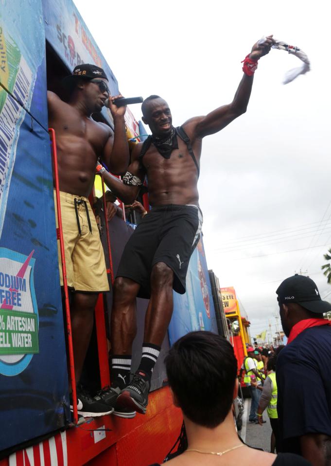  Olympic champion Usain Bolt whips his shirt at the Trinidad carnival in February