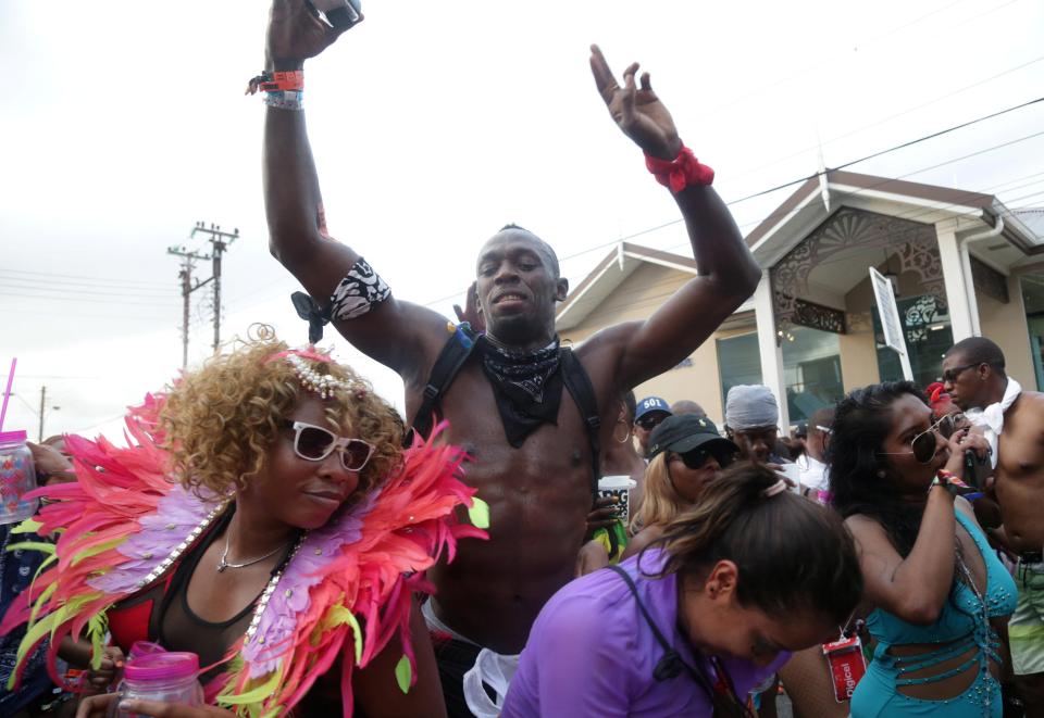  Usain Bolt parties with a bevvy of women during carnival celebrations in Port-of-Spain, Trinidad