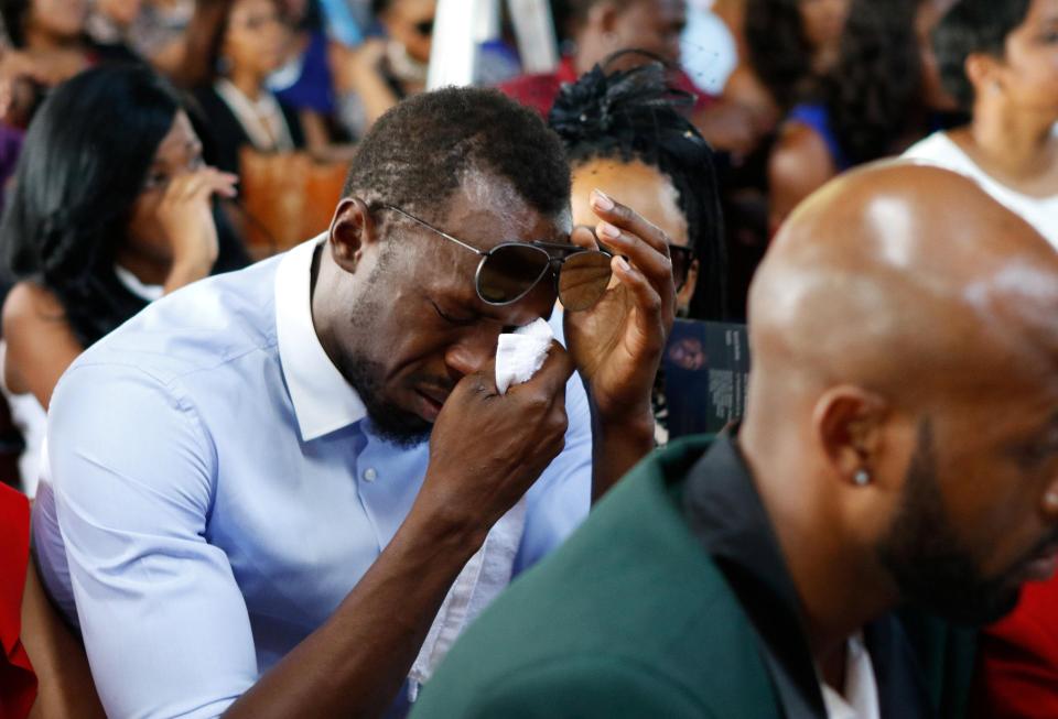  Jamaica's Usain Bolt weeps at the funeral service for British high jump star Germaine Mason, who died in April 20 in a motorbike crash