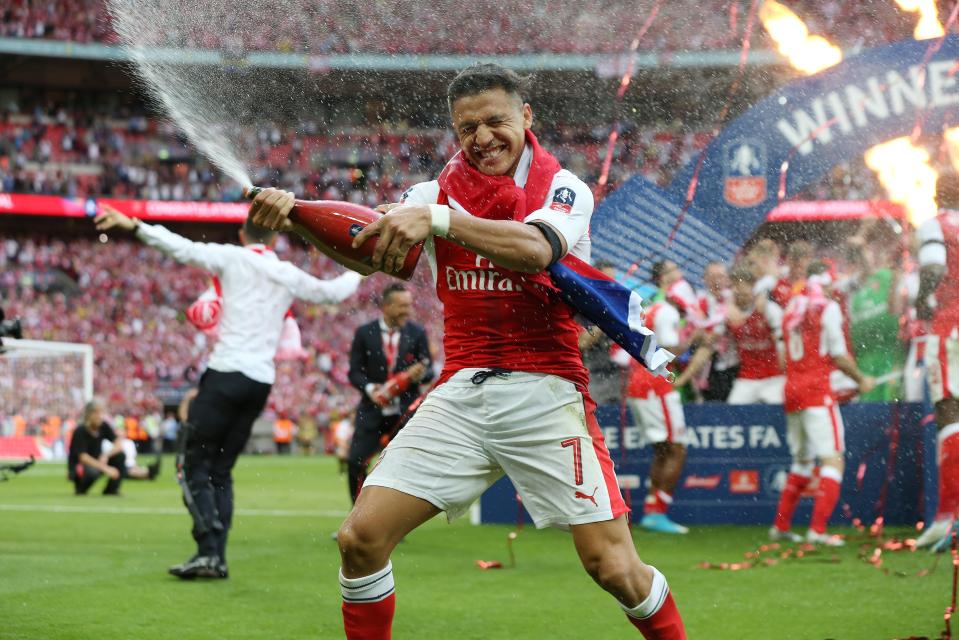 Alexis Sanchez celebrates winning FA Cup with Arsenal last season