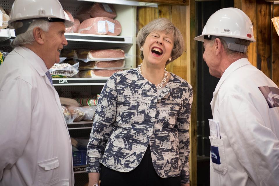  The day before the election, the PM chuckled alongside traders at London's Spitalfields meat market - though some booed her